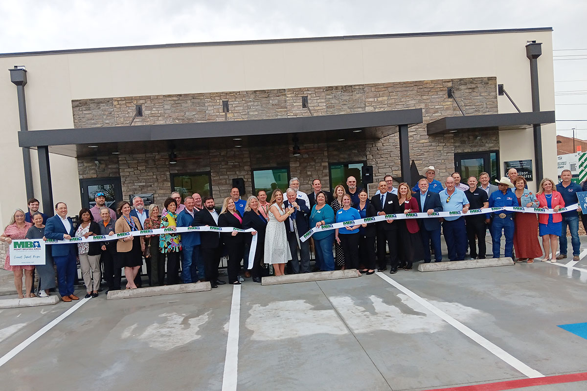 Past and current board members join with key contributors in the official ribbon cutting for the Mont Belvieu Area Chamber of Commerce Business Center.